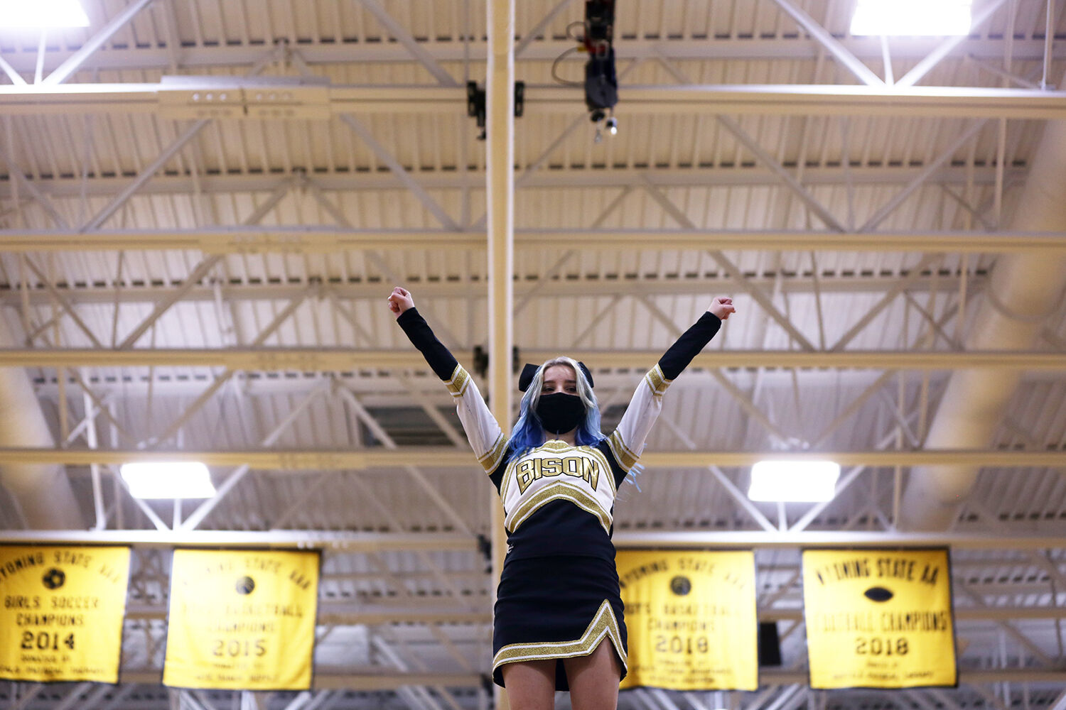 Emma Pierson stretches her arms in front of the crowd